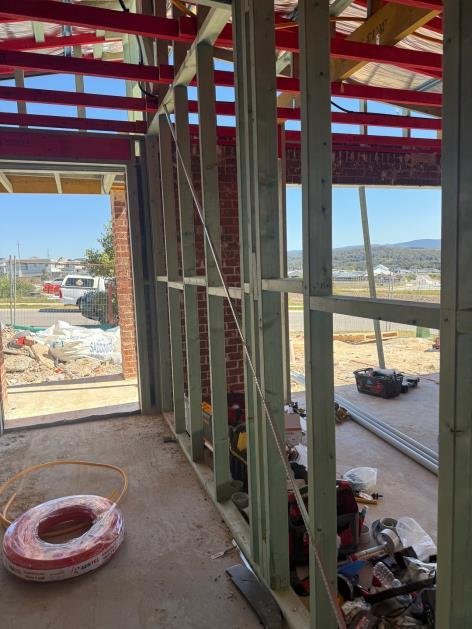 Upper floor bracing panel — tie-down bolt missing — engineering non-compliance requiring rectification.