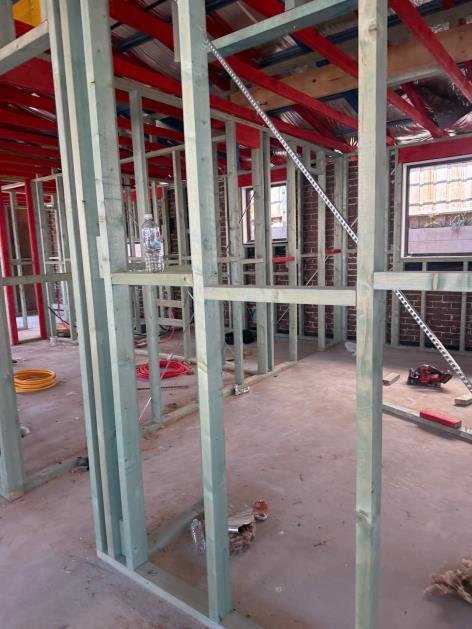 Roof truss without hurricane strap tie-down — AS 1684 wind uplift non-compliance — strap installation required.