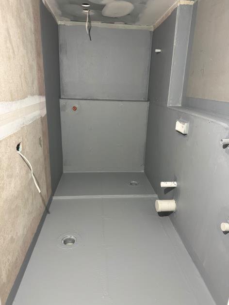 Powder room splash zone — membrane height compliant at 100mm minimum — cleared for tiling.